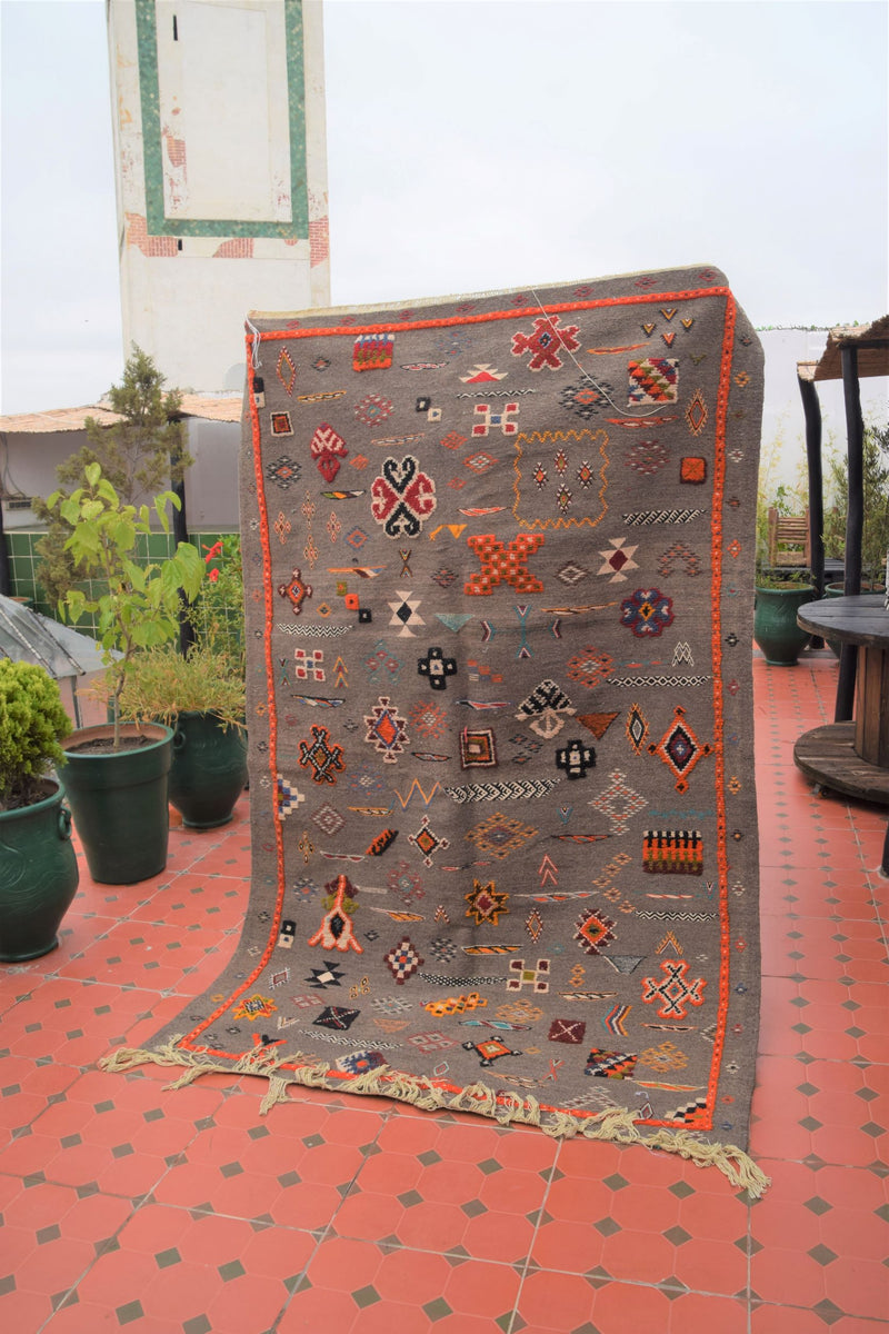 Multi-colour Taznakht rug with Amazigh symbols