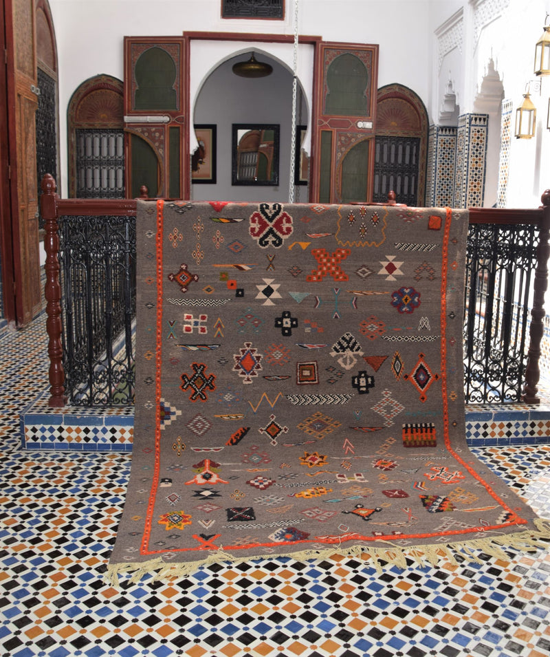 Multi-colour Taznakht rug with Amazigh symbols