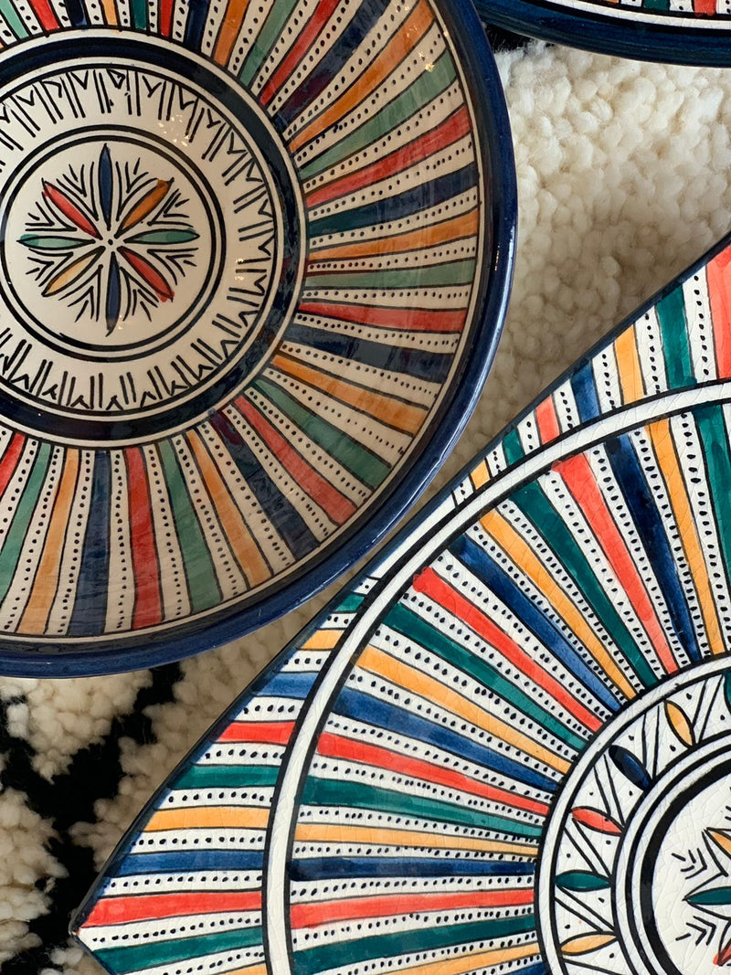 A set of two multi-coloured bowls and two plates