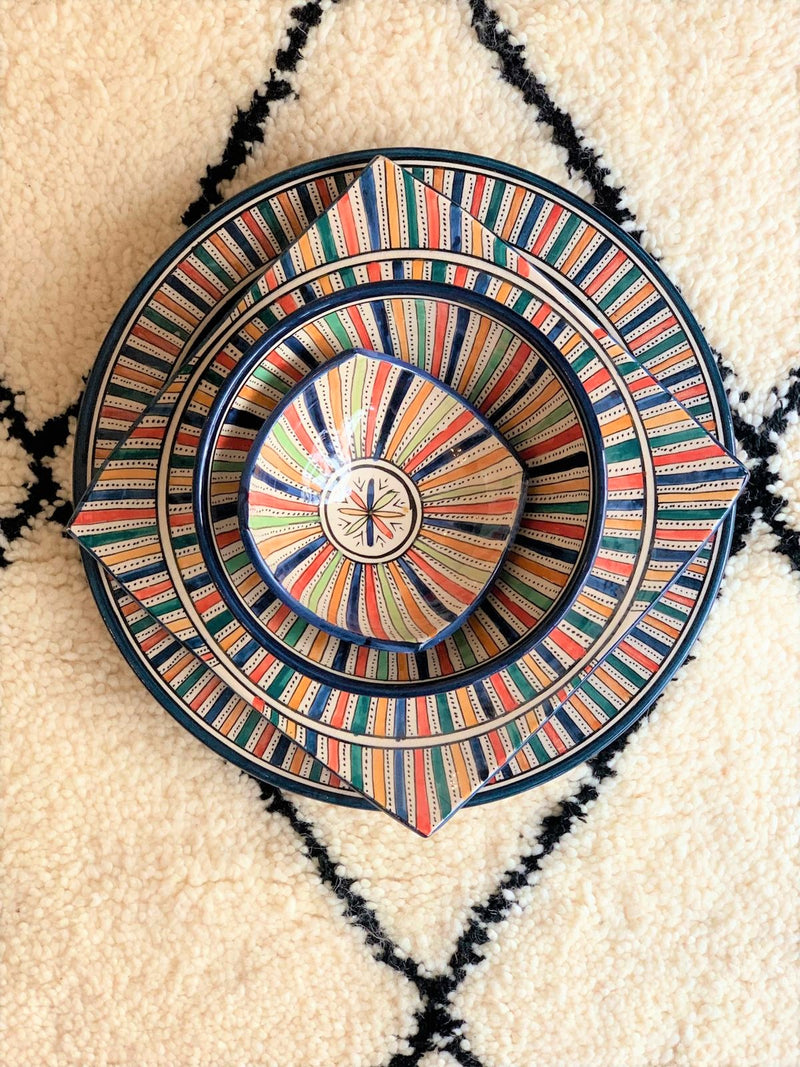 A set of two multi-coloured bowls and two plates