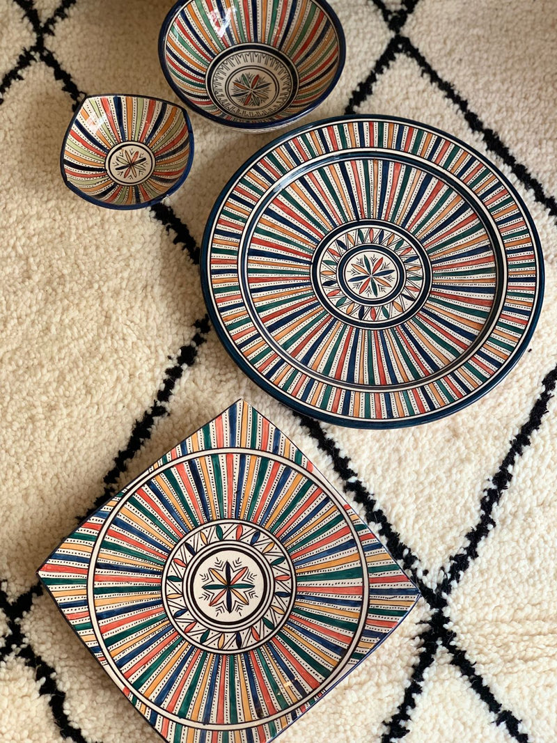 A set of two multi-coloured bowls and two plates