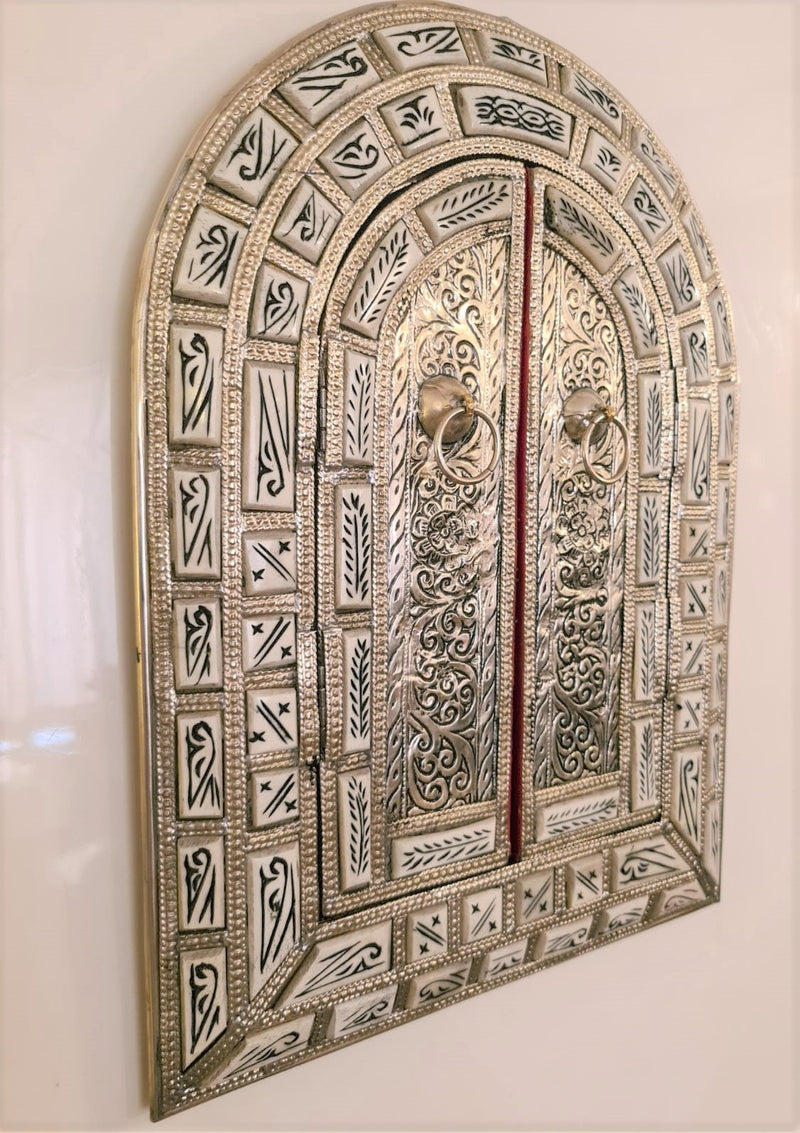Amazingly detailed metal and bone mirror